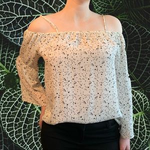 Pleione white blouse with black specs.
